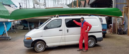 Ian Bowles with a Scout canoe